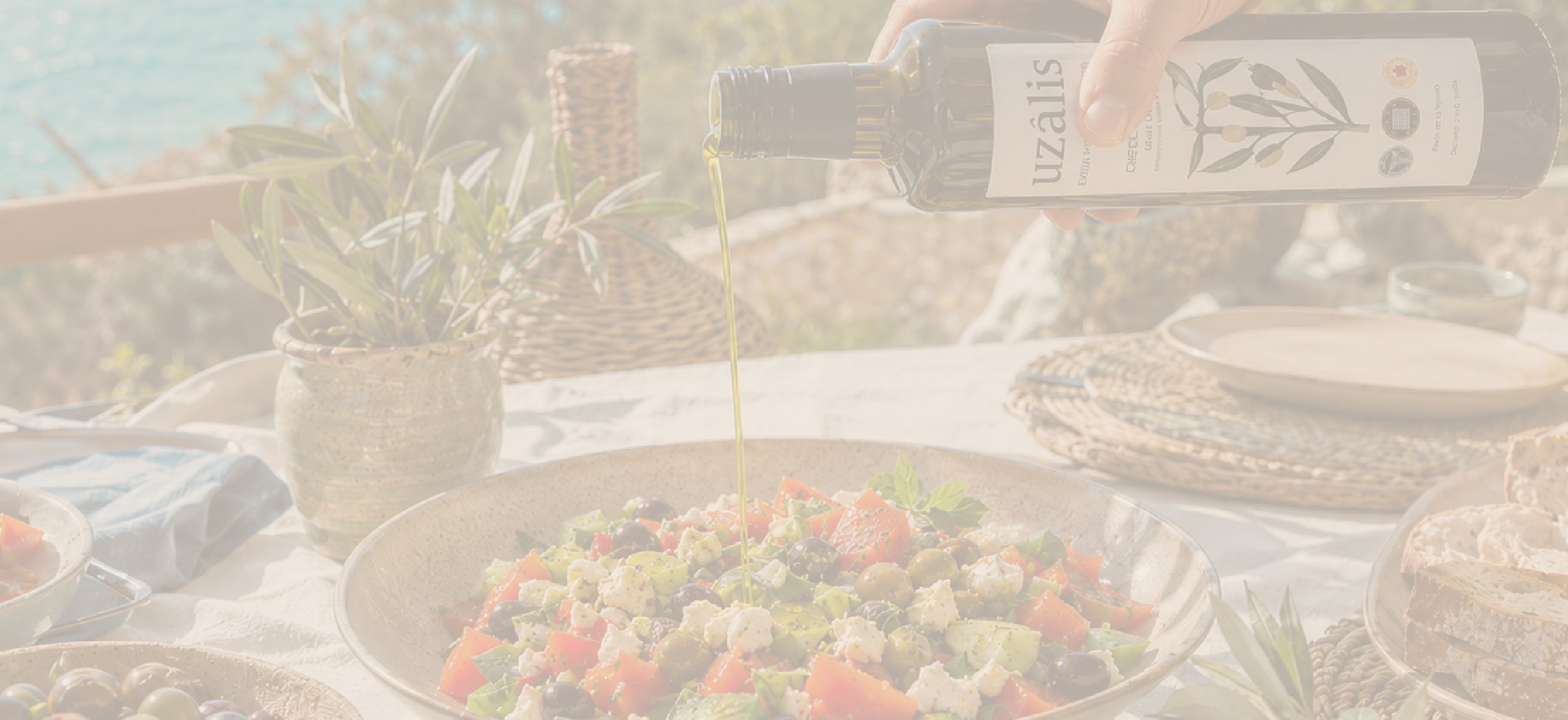 Premium Tunisian extra virgin olive oil drizzled over fresh Mediterranean salad